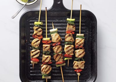 Swordfish and veggie skewers with creamy avocado sauce