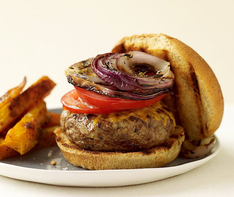 Cheeseburgers with grilled onions