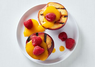 Grilled stone fruit with fresh mango sauce
